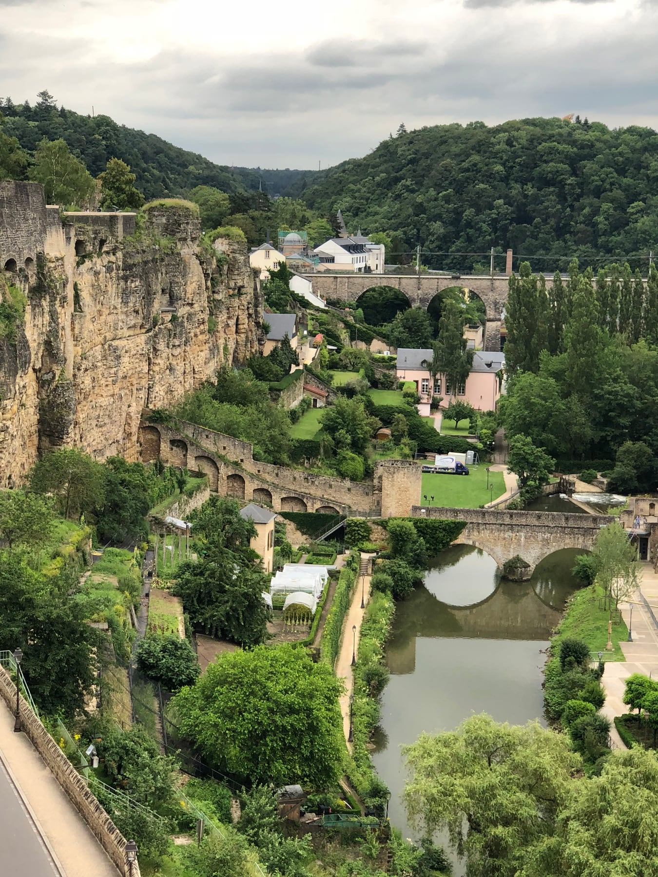 Green valley crossed by stone bridges in Luxembourg